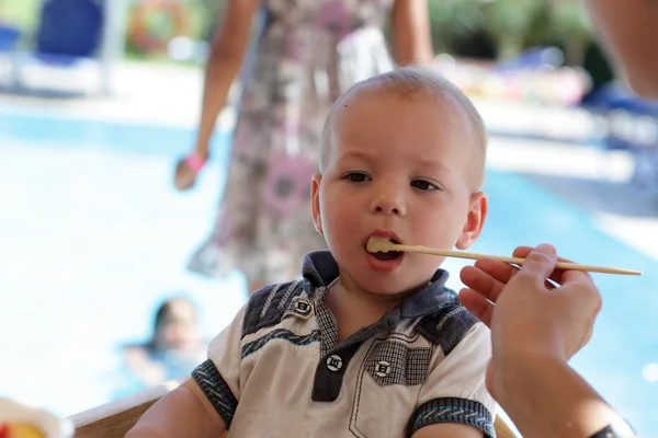 Baby eating porridge — Stock Photo, Image