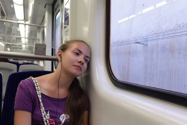 Girl resting in train — Stock Photo, Image