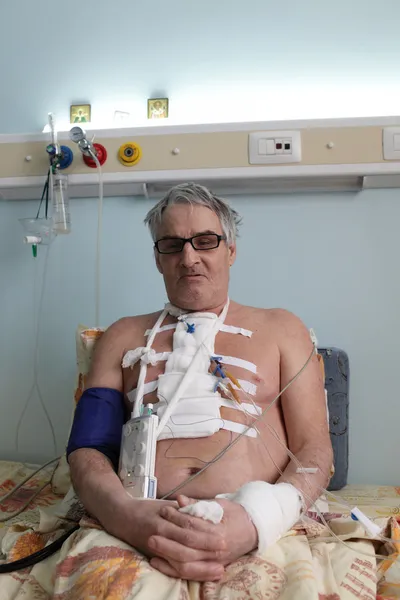 Senior man with white bandage on chest — Stock Photo, Image