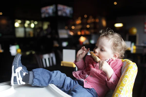 Toddler eating kebab — Zdjęcie stockowe