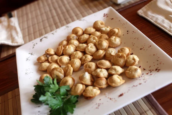 Fried pelmeni on the white plate — Stock Photo, Image
