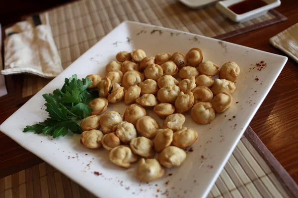 Plate of fried dumplings — Stock Photo, Image
