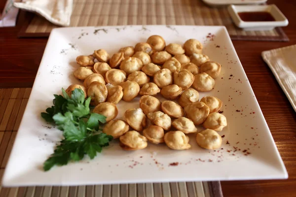 Plate of fried pelmeni — Stock Photo, Image