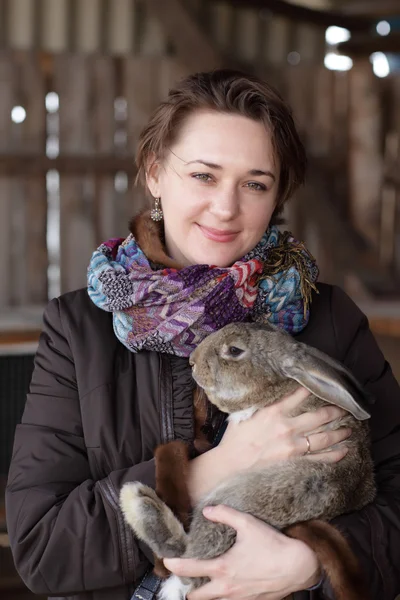 Woman holding rabbit — Stock Photo, Image