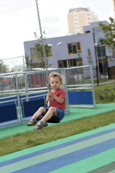 Curly boy at cableway — Stock Photo, Image