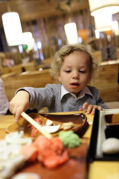 Child taking ginger — Stock Photo, Image