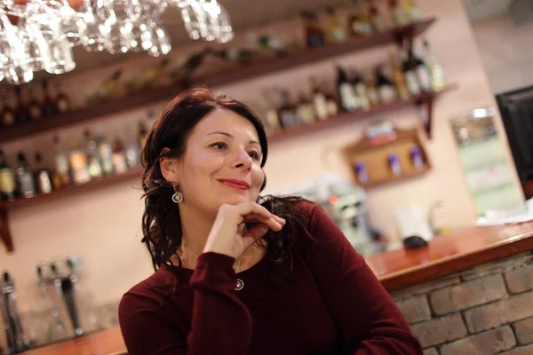 Woman next to a bar — Stock Photo, Image