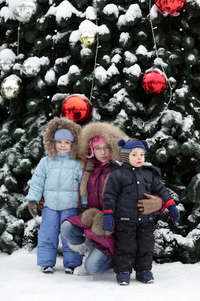 Children and Christmas tree Stock Photo