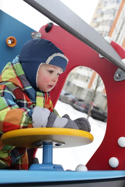 Toddler in the toy car — Stock Photo, Image