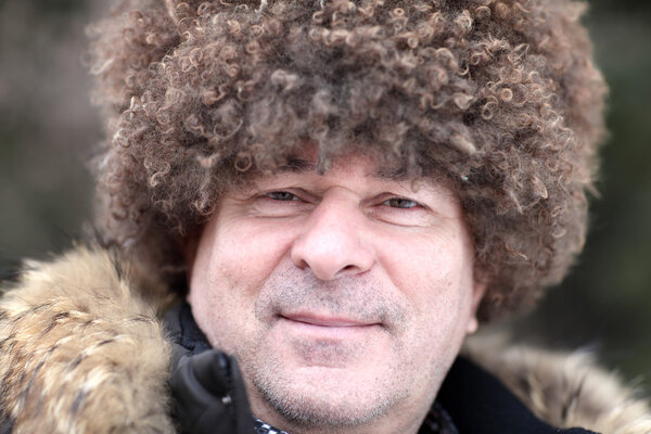Man posing in caucasian hat
