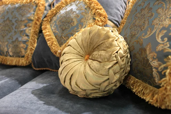 Golden round cushion — Zdjęcie stockowe