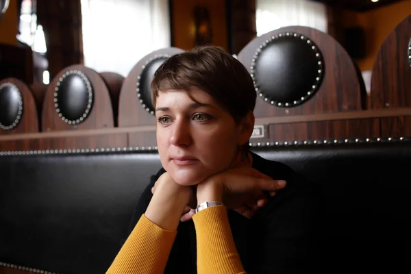 Pensive woman in cafe — Stock Photo, Image