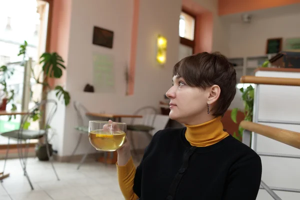 Woman with glass of tea — Stock Photo, Image