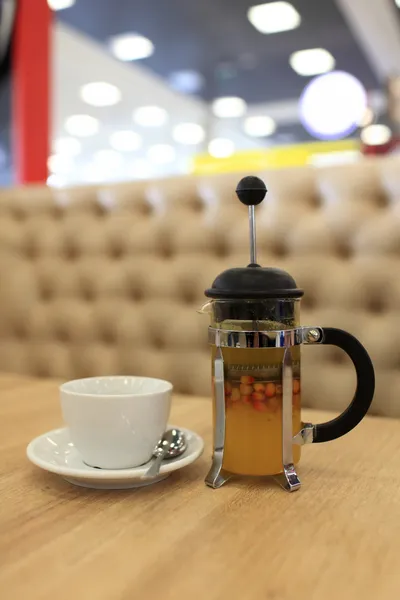 Buckthorn tea in a french press — Stock Photo, Image