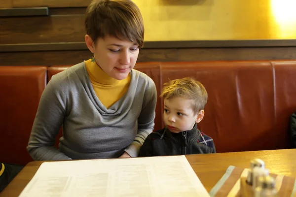 Family with menu — Stock Photo, Image