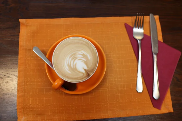 Cup of coffe on a tablecloth — Stock Photo, Image