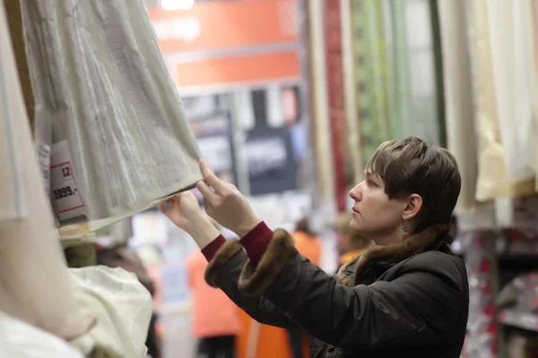 Person choosing curtains — Stock Photo, Image