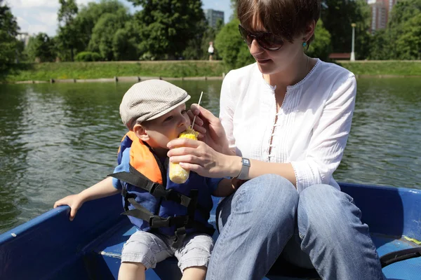 Mother with son in the boat — Stock Photo, Image