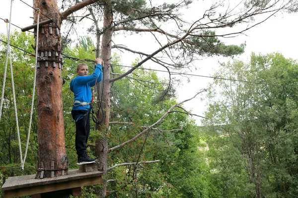 Serious Boy Overcomes Obstacle Course Rope Park — Stock Photo, Image