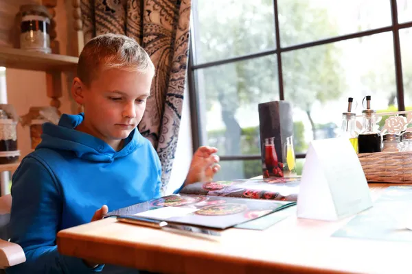 Child Chooses Dishes Menu Restaurant — Stock Photo, Image