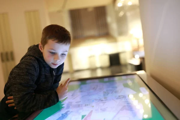 Portrait Kid Plays Touch Screen Entertainment Center — Stock Photo, Image