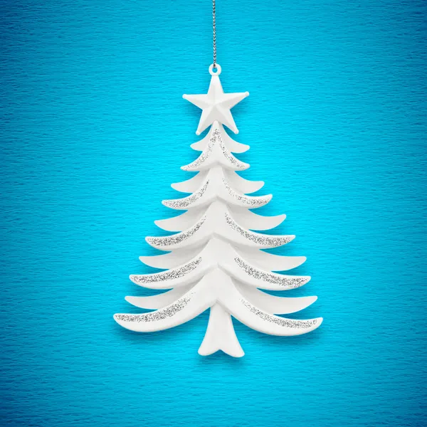 Weihnachtsbaum auf blauem Papier — Stockfoto