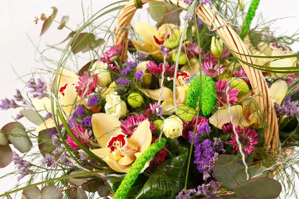 Beautiful flowers in a basket — Stock Photo, Image