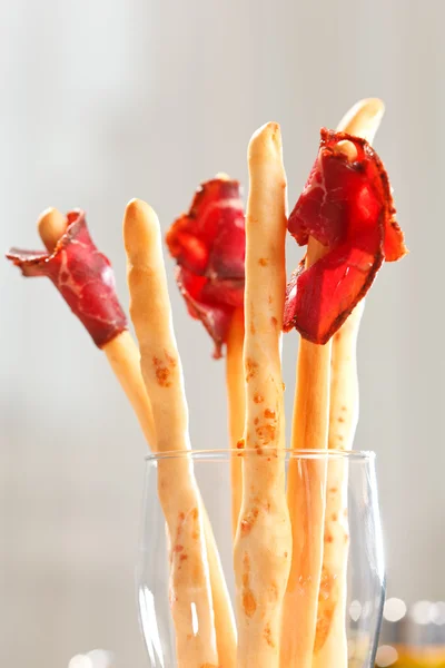 Bread-stick with parma ham — Stock Photo, Image