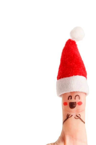 Палець одягнений у червоно-білі капелюхи Санта-Клауса — стокове фото