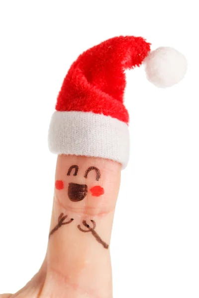 Палець одягнений у червоно-білі капелюхи Санта-Клауса — стокове фото