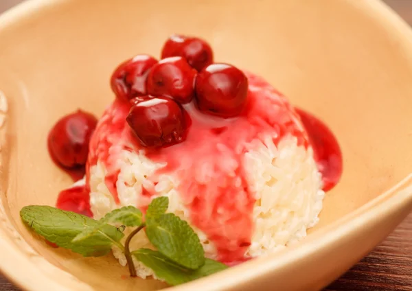 Rice pudding with cherry — Stock Photo, Image