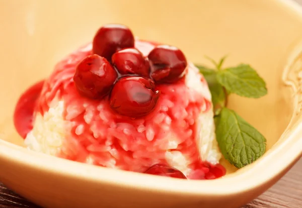 Rice pudding with cherry — Stock Photo, Image