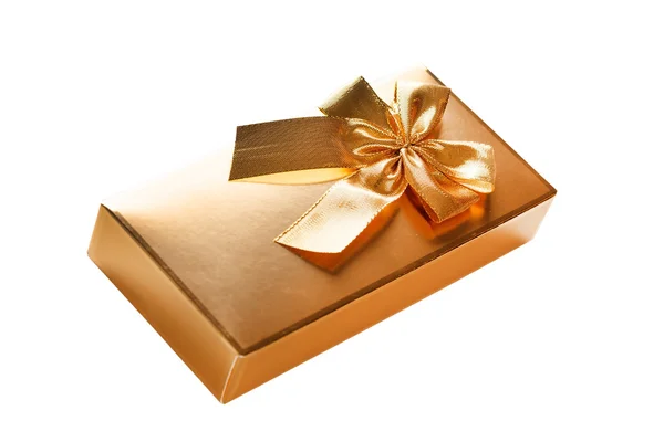 Gold gift box with gold ribbon — Stock Photo, Image