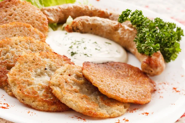 Potato pancakes with sausage — Stock Photo, Image