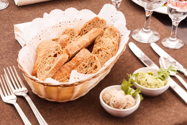 Fresh crusty bread in a basket — Stock Photo, Image