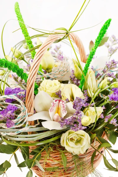 Beautiful flowers in the basket — Stock Photo, Image