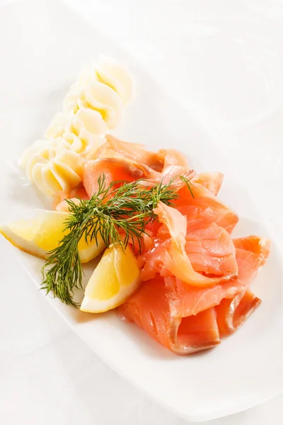 Salmon with butter — Stock Photo, Image