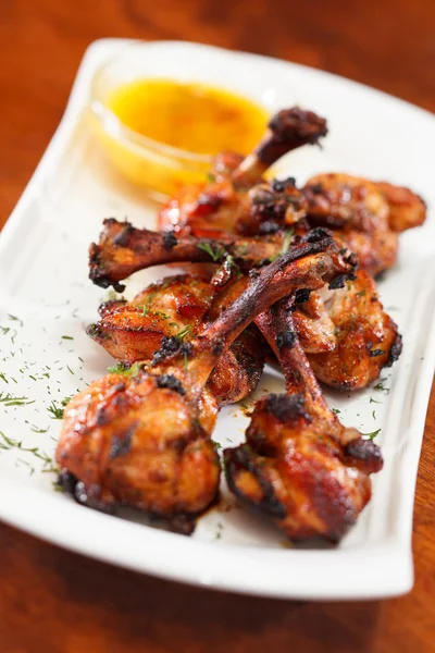 Chicken wings with sauce — Stock Photo, Image