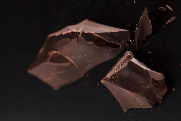 Chocolate on black background — Stock Photo, Image