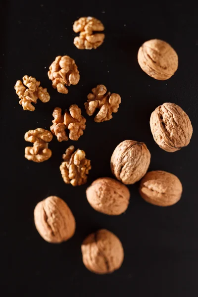 Walnuts on black background — Stock Photo, Image