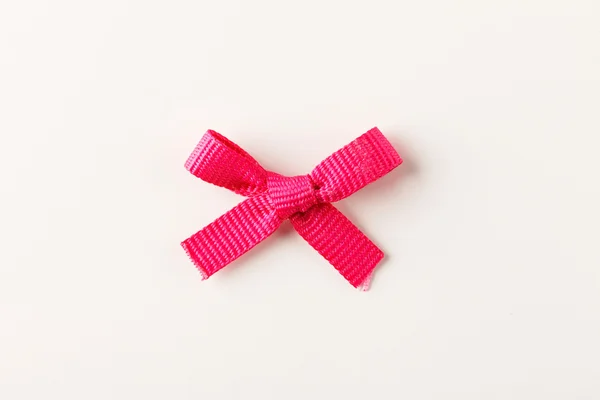 Roze geschenk boog — Stockfoto
