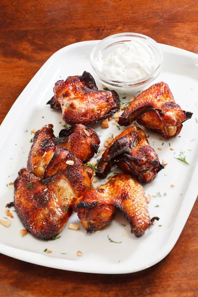 Chicken wings with sauce — Stock Photo, Image