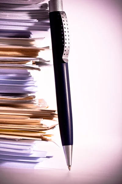 A pen near stack of paper — Stock Photo, Image