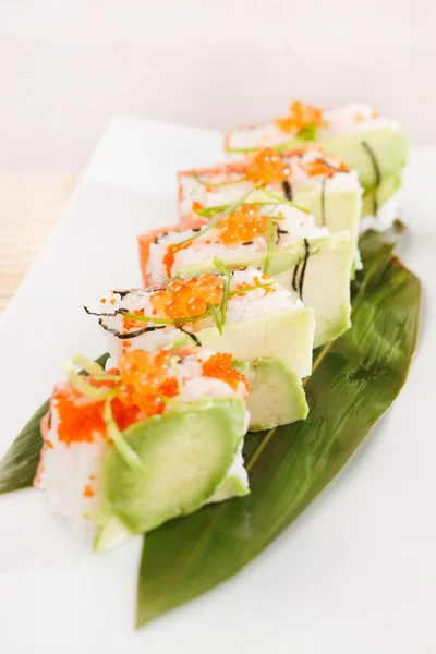 Tasty sushi with avocado — Stock Photo, Image