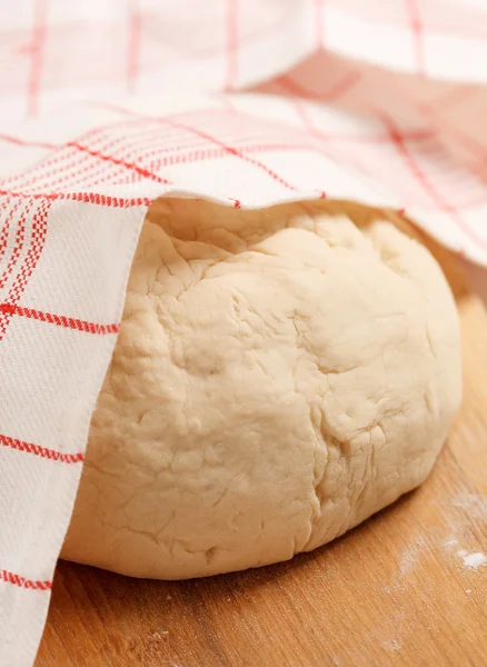 Dough on wooden board — Stock Photo, Image