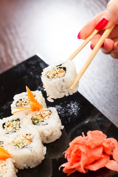 Sushi with chopsticks — Stock Photo, Image