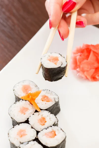 Sushi with chopsticks — Stock Photo, Image