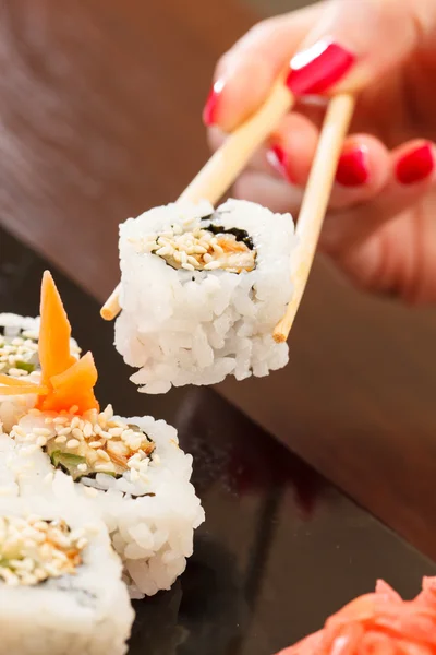 Sushi with chopsticks — Stock Photo, Image