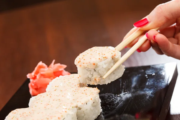 Sushi with chopsticks — Stock Photo, Image