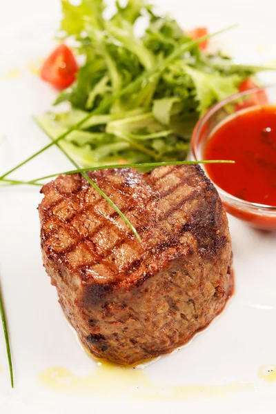 Grilled steak with sauce — Stock Photo, Image